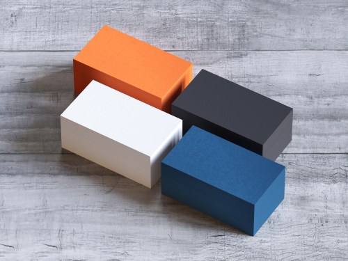 Different business cards on wood desk