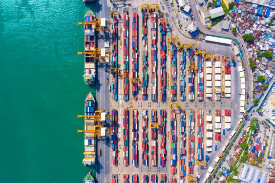 Aerial view of logistic port with container ship for import and export shipping in Southeast Asia