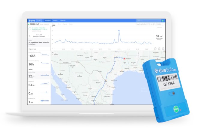 Tive tracker over computer displaying tracking data software.