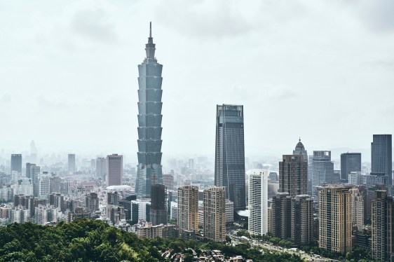 Taipei 101 amidst modern buildings against sky in city