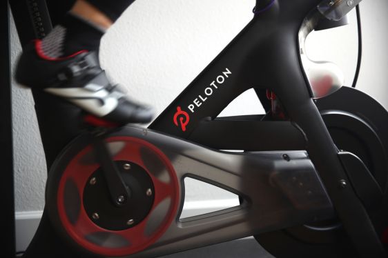 SAN ANSELMO, CALIFORNIA - APRIL 06: Cari Gundee rides her Peloton exercise bike at her home on April 06, 2020 in San Anselmo, California. More people are turning to Peloton due to shelter-in-place orders because of the coronavirus (COVID-19). Peloton stock has continued to rise over recent weeks even as most of the stock market has plummeted. However, Peloton announced today that they will temporarily pause all live classes until the end of April because an employee tested positive for COVID-19. (Photo by Ezra Shaw/Getty Images)