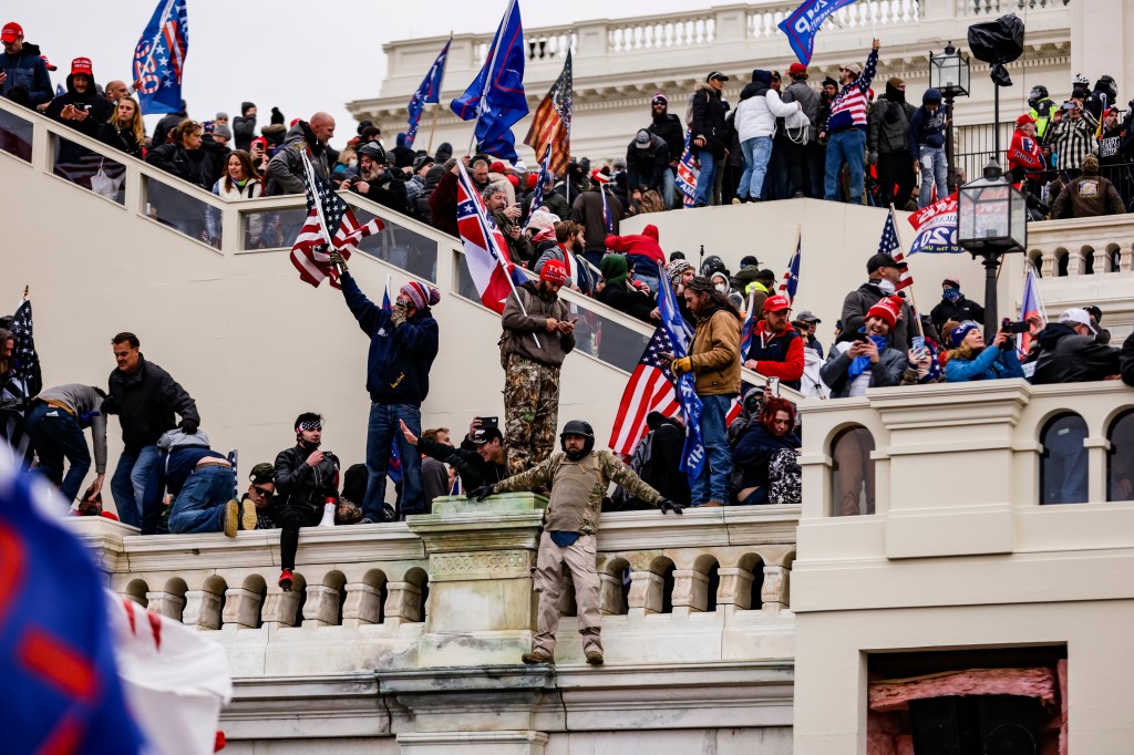 WASHINGTON, DC - JANUARY 06: Pro-Trump supporters storm the U.S. Capitol following a rally with President Donald Trump on January 6, 2021 in Washington, DC. Trump supporters gathered in the nation's capital today to protest the ratification of President-elect Joe Biden's Electoral College victory over President Trump in the 2020 election. (Photo by Samuel Corum/Getty Images)