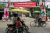Commuters make their way in front of the banners ahead of the reopening of the parliament on February 1 following the November 2020 elections which Aung San Suu Kyi's ruling National League of Democracy (NLD) won in a landslide, in Yangon on January 30, 2021. (Photo by Sai Aung MAIN / AFP) (Photo by SAI AUNG MAIN/AFP via Getty Images)
