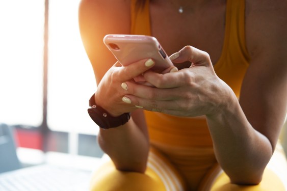 Young woman playing games on a smartphone