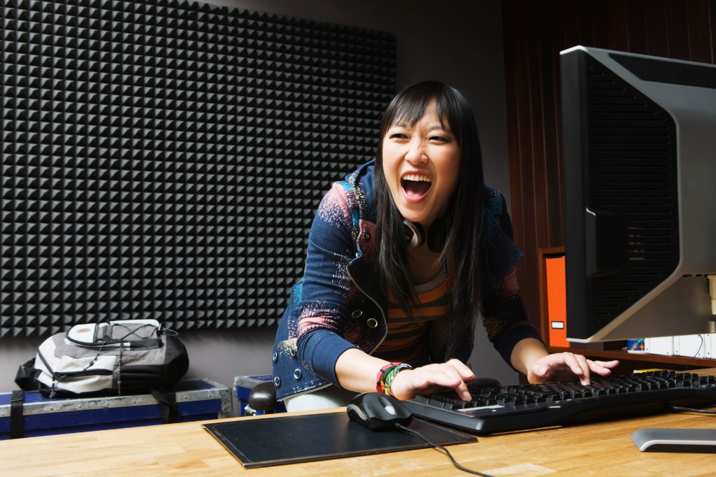 girl playing games on desktop computer
