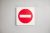 Red and white do not enter sign on the wall