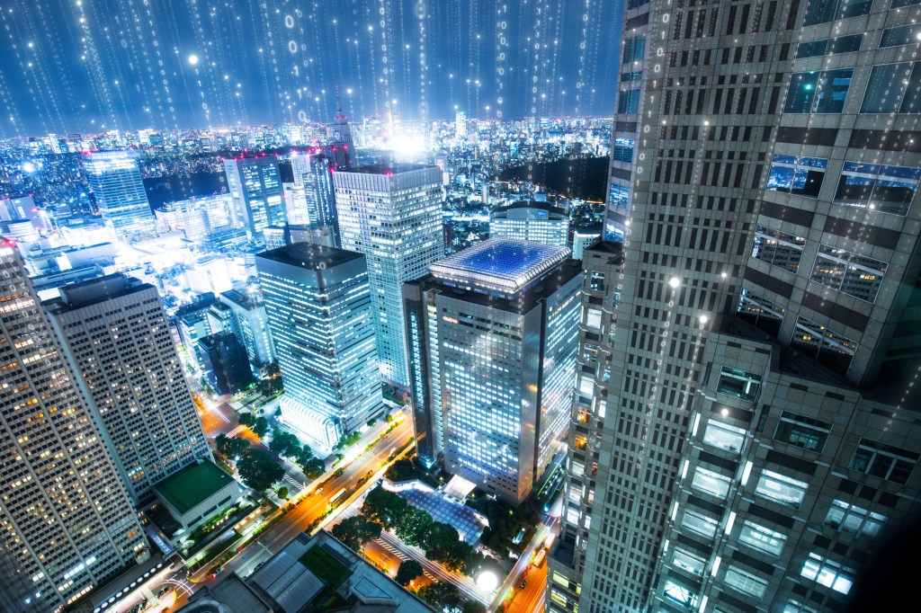 Smart buildings communicating data in a city.