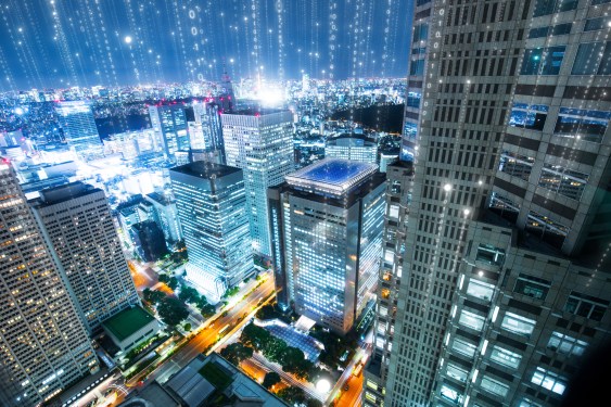 Smart buildings communicating data in a city.