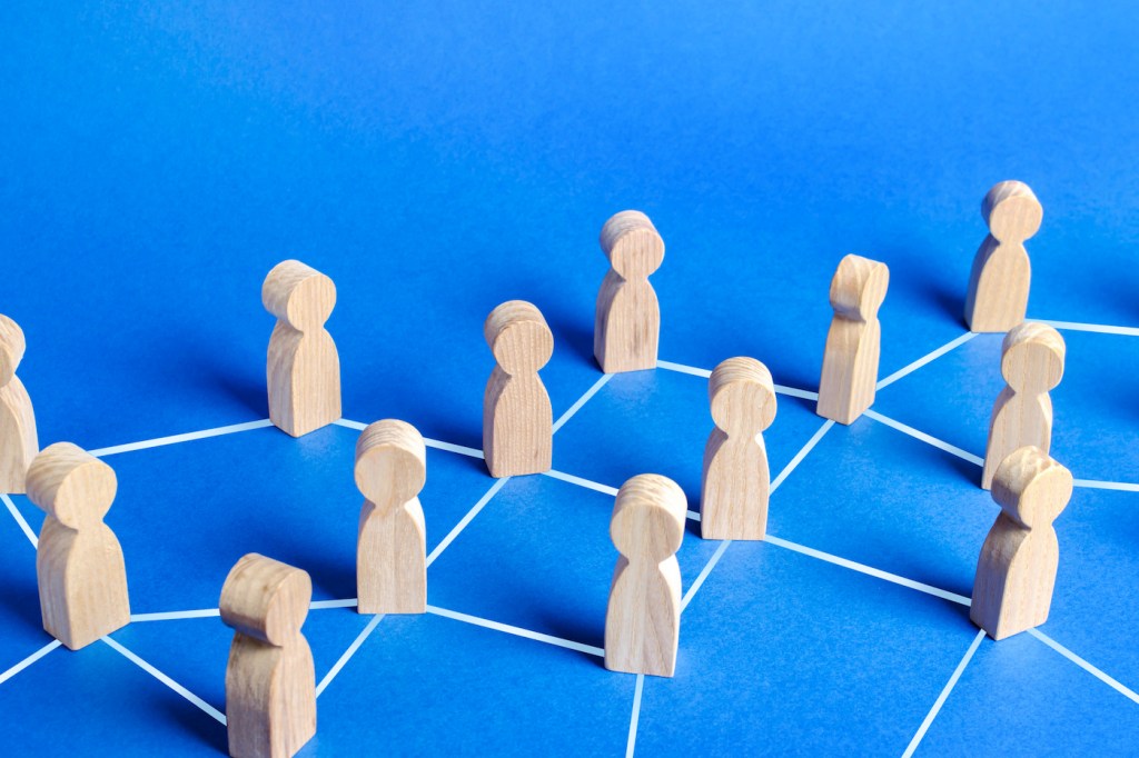 Figures of people connected by lines in a network. Communication and social networks. Cooperation and collaboration. Contact between participants, a team of employees. Society. Spread of information (Figures of people connected by lines in a network.