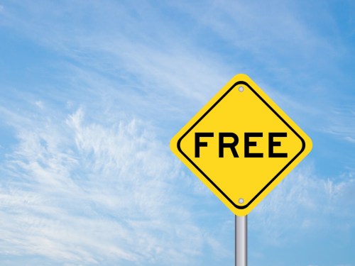 Yellow transportation sign with word free on blue sky background