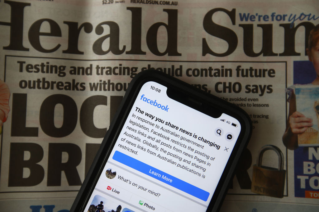 A message is seen on Facebook mobile, on February 18, 2021 in Melbourne, Australia. Facebook has banned publishers and users in Australia from posting and sharing news content as the Australian government prepares to pass laws that will require social media companies to pay news publishers for sharing or using content on their platforms.