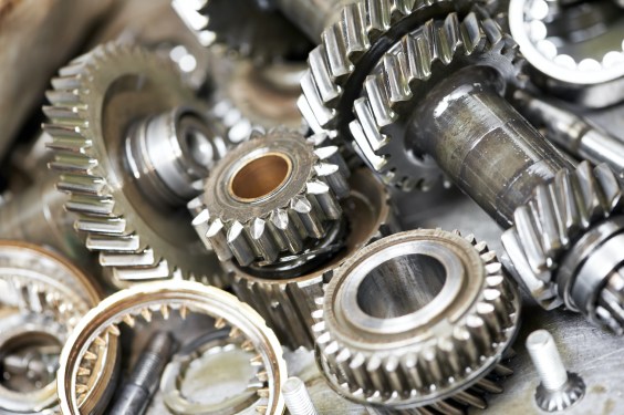 Close-up of automobile engine steel gears and bearings disassembled for repair at car service station