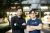 Two people standing next to one another, arms crossed. Company founders
