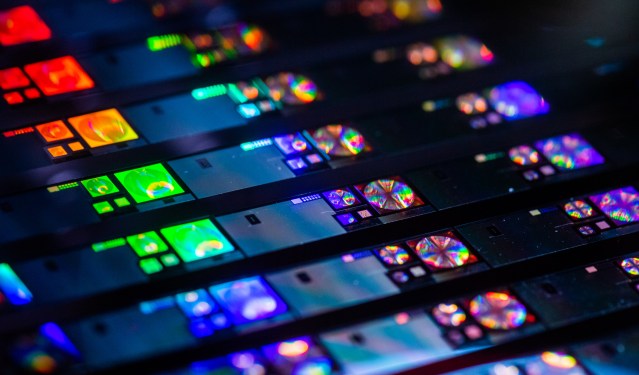 Close-up photo of many computer chips just after manufacturing.