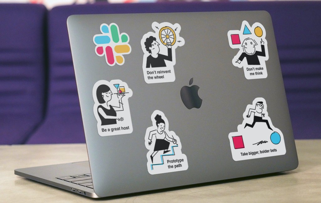 laptop with five stickers representing product principles
