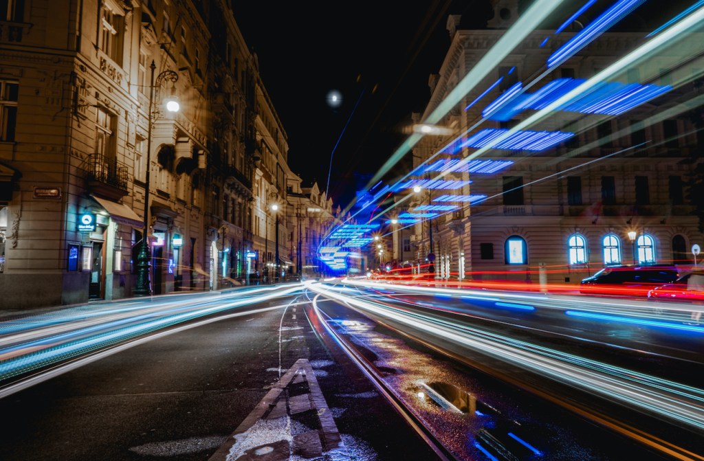 With an almost full moon and and ambulance passing by this long exposure shot of cars and trams passing by in Prague old town came out cooler than expected
