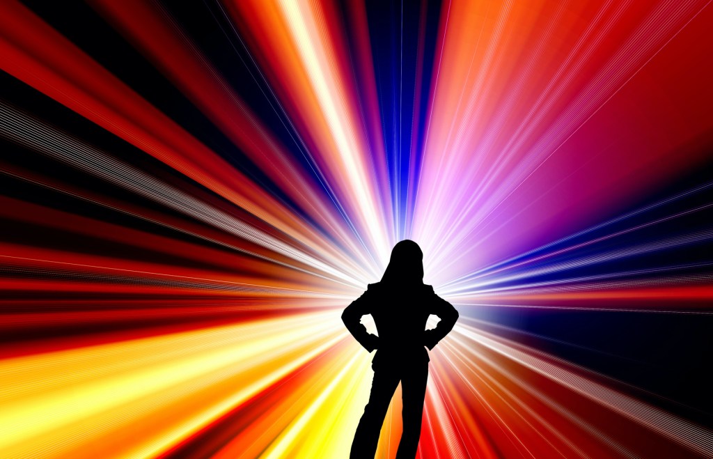 Silhouette of woman in colourful abstract background