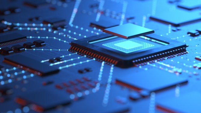 Blue tinted mother board focussed on CPU chip in center