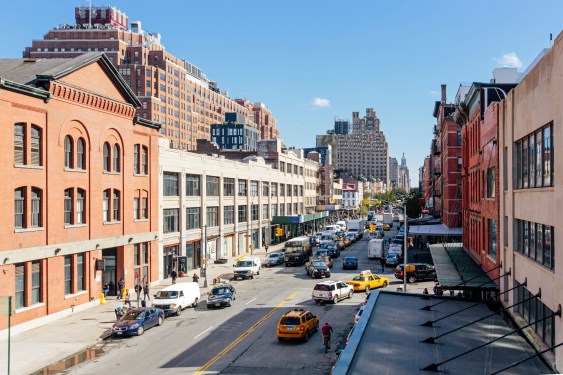 Image of cars turning onto a street in New York City.