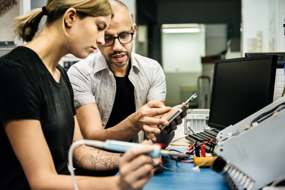 Technician mentoring apprentice