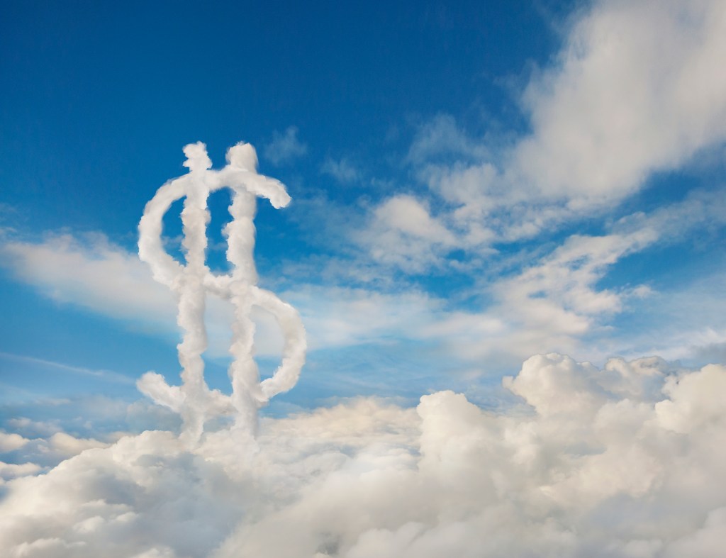 Dollar sign in cloudy sky