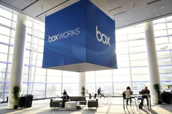 Attendees sit underneath Box Inc. signage during the BoxWorks 2017 Conference at the Moscone Center in San Francisco, California, U.S., on Wednesday, Oct. 11, 2017. BoxWorks brings together leaders across the technology sector to define the future of work and build digital-first companies. Photographer: Michael Short/Bloomberg via Getty Images