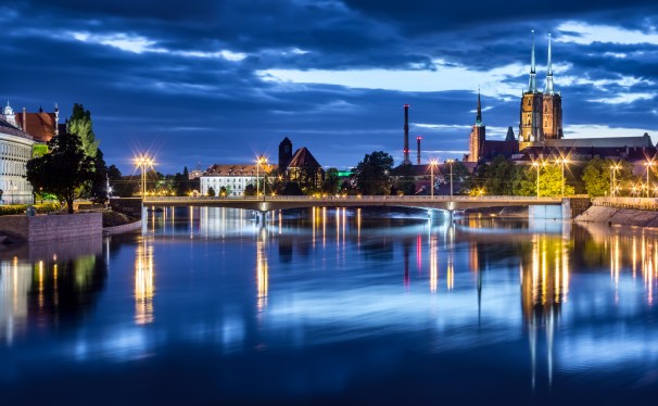 Clouds over illuminated cityscape, Wroclaw, Poland
