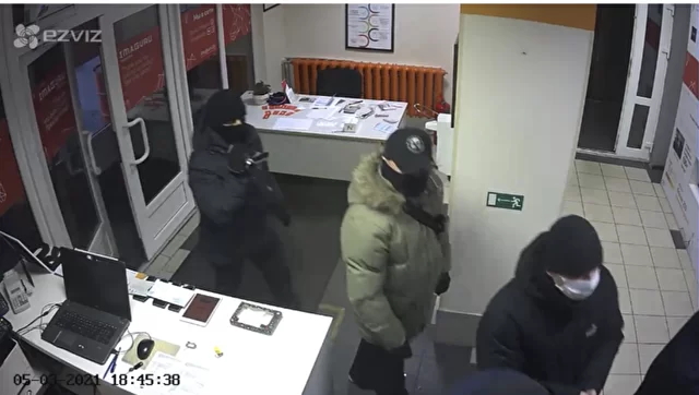 Masked men enter the Imaguru startup hub in Minsk