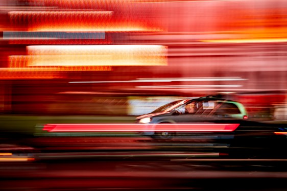 Image of a car amid blurry lights.