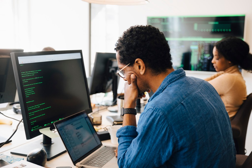 Software engineer deeply involved with coding.