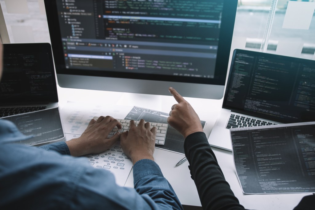 Cropped Image Of engineers coding
