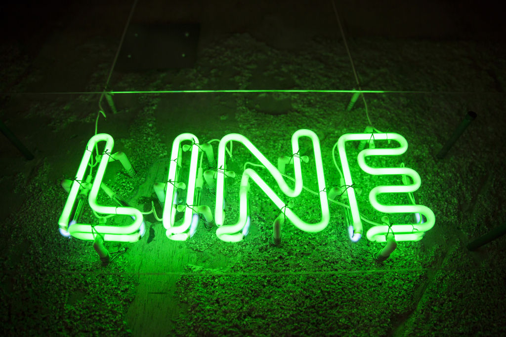 A neon sign is displayed inside Line Corp.'s research and development facility in Kyoto, Japan, on Wednesday, July 25, 2018.