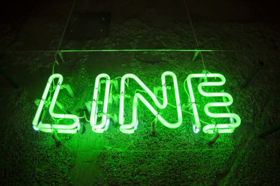 A neon sign is displayed inside Line Corp.'s research and development facility in Kyoto, Japan, on Wednesday, July 25, 2018.