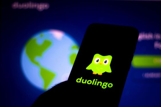 In this photo illustration the Duolingo logo seen displayed on a smartphone.