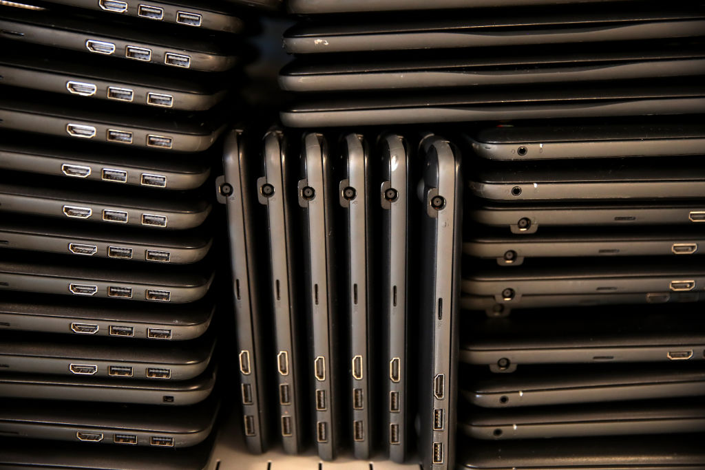 Piles of Chromebooks
