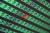 red email envelope in a sea of green email envelopes