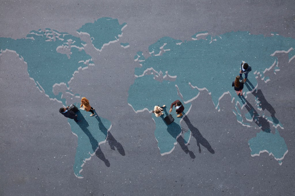Group of young adults, photographed from above, on various painted tarmac surface, at sunrise.