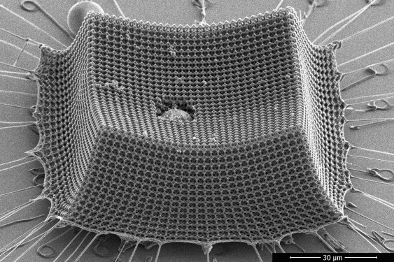 Image of a microscopic matrix of particles impacted by a larger one.