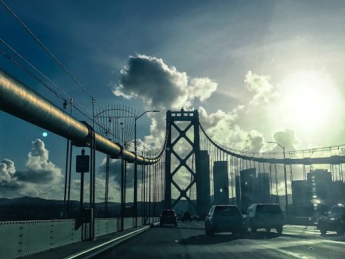 Cars on the San Francisco-Oakland Bay Bridge driving west towards San Francisco.
