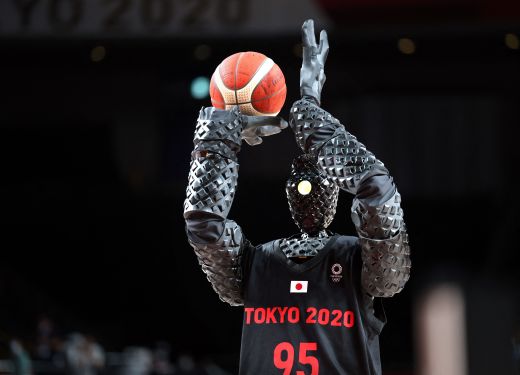 A basketball-playing robot named CUE plays basketball during half-time of the Men's Preliminary Round Group B game between the United States and France on July 25, 2021, during Tokyo 2020 Olympic Games at Saitama Super Arena.