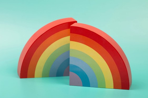 Two parts of rainbow on mint background. Front view.