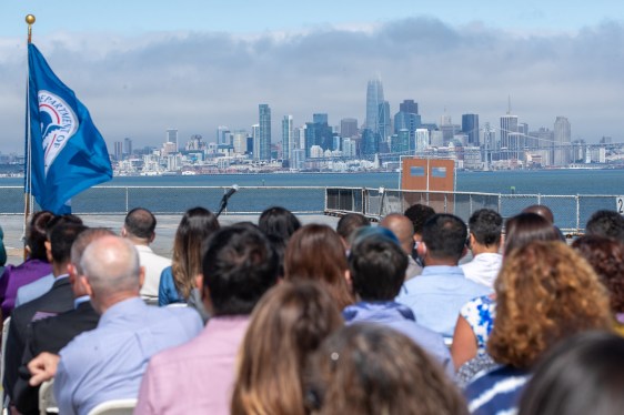 ALAMEDA, CA - JULY 2: The San Francisco skyline is seen in the background as new American citizens and family members attend a naturalization ceremony on the flight deck of the USS Hornet Museum in Alameda, Calif., on Friday, July 2, 2021. A total of 50 new American citizens from 30 countries took the Oath as part of the annual Independence Day celebrations. (Photo by Ray Chavez/MediaNews Group/The Mercury News via Getty Images)