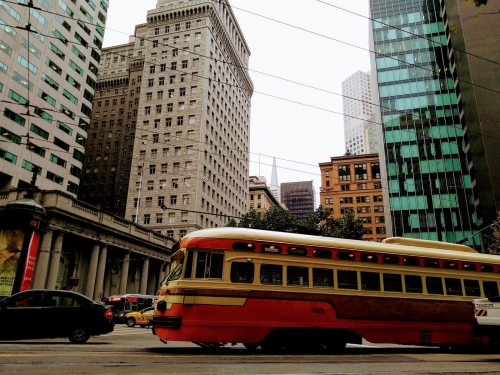 A restored vintage streetcar on Market Street in San Francisco heading west at Sutter Street.
