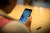 person looking at smartphone