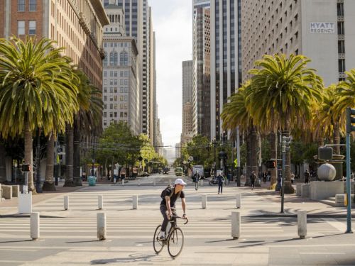 A cyclist bikes through Embarcadero Plaza as Silicon Valley moves slowly to reopen in San Francisco, California, U.S., on Tuesday, June 1, 2021. The region's tech giants, among the first to send their office workers home when coronavirus pandemic deepened last year, may be among the last to coax them back. Photographer: Jim McAuley/Bloomberg via Getty Images