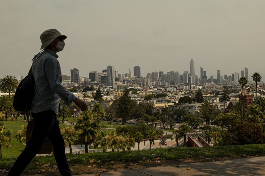 Smoke from wildfires over San Francisco, California, U.S., on Thursday, Aug. 19, 2021. The Bay Area Air Quality Management District issued a Spare the Air alert for Thursday and Friday as smoke from the Northern California wildfires drifts into the region. Photographer: David Paul Morris/Bloomberg via Getty Images