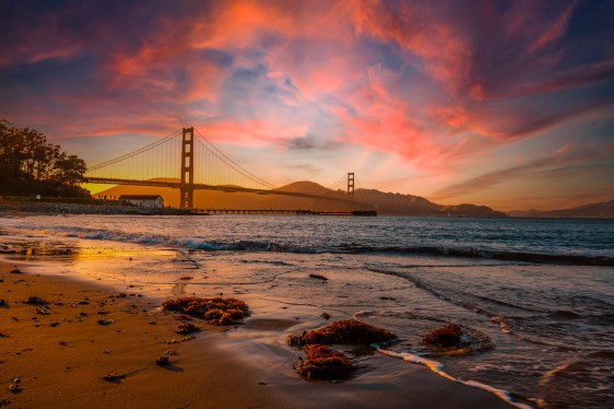 Gorgeous orange sunset with pink clouds over the Golden Gate in San Francisco, California. United States