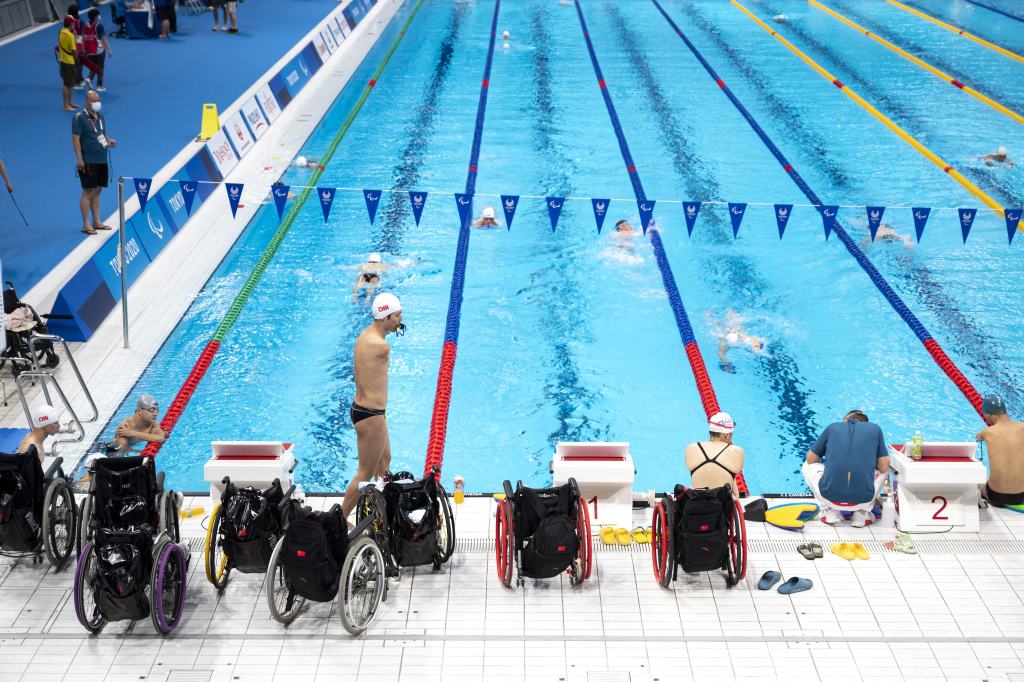 Wheelchairs are pictured poolside during a swim training session ahead of the Tokyo 2020 Paralympic Games on August 23, 2021.