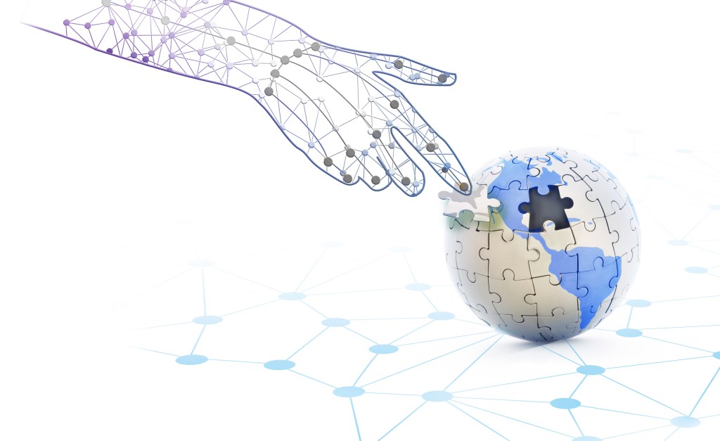 Image of a digital hand placing the last piece of a puzzle globe to represent fragmented digital privacy legislation.