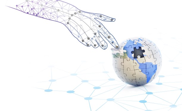 Image of a digital hand placing the last piece of a puzzle globe to represent fragmented digital privacy legislation.